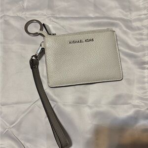 Michael Kors Ivory Wristlet with Silver Accents